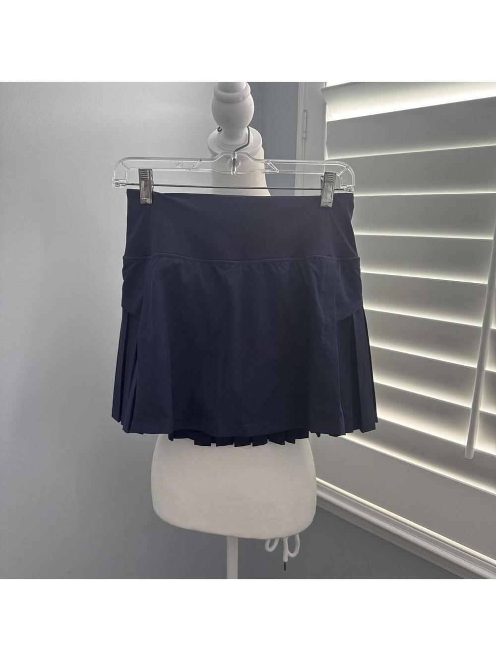 Navy blue pleated tennis skirt with built-in shorts Size Small  Never worn.